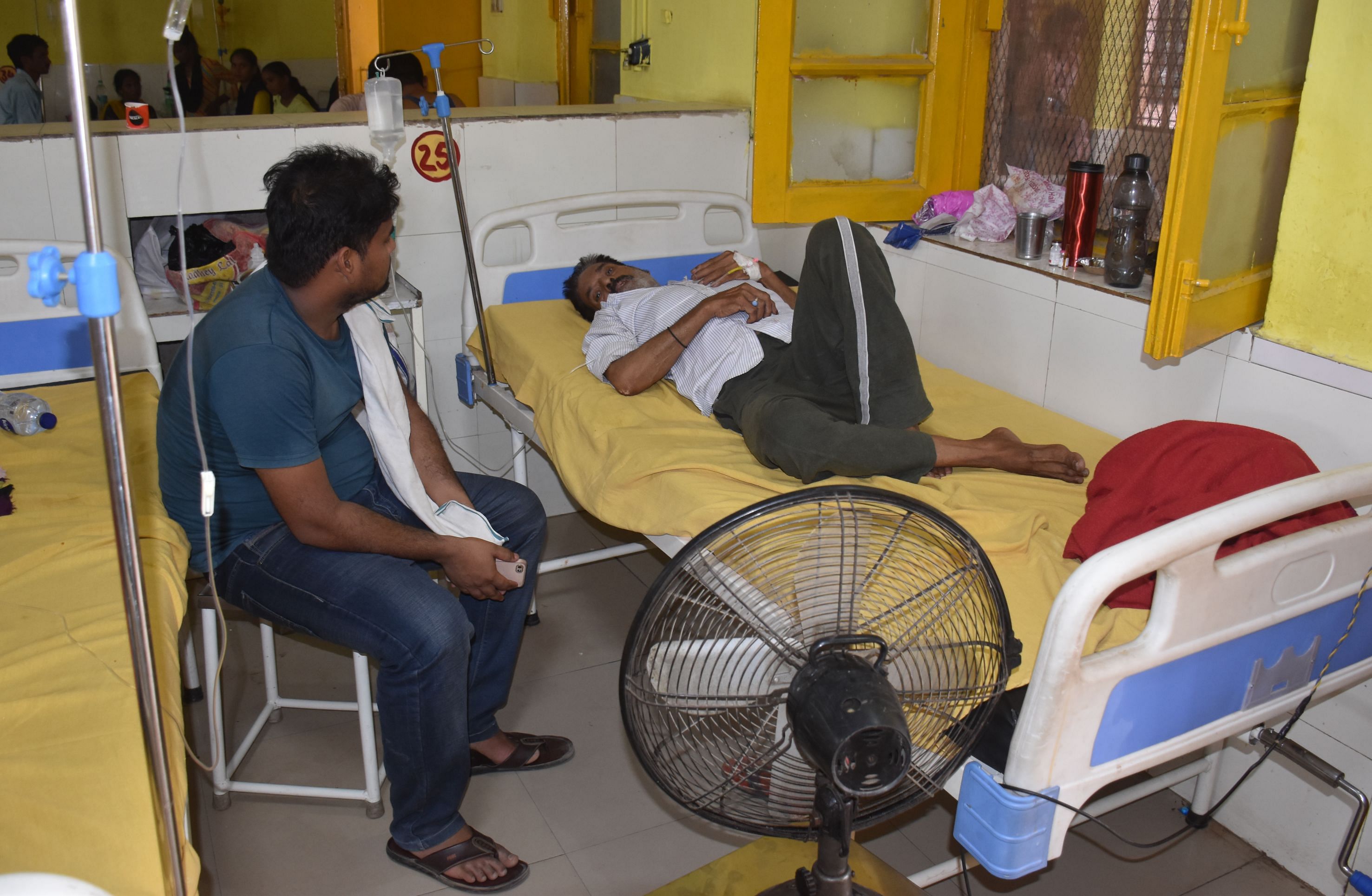 Attendants fanning a patient in the children’s ward of the district hospital. 